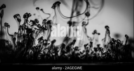 Greyscale shot of beautiful patterns formed from the black smoke Stock Photo