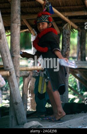 A young ethnic, indigenous Mien (Yao) girl in her village in northern Thailand. Stock Photo