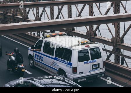 NEW YORK, UNITED STATES - Sep 21, 2017: A police van is responding to an accident on the Brooklyn bridge while in traffic next to a motorcycle. Stock Photo