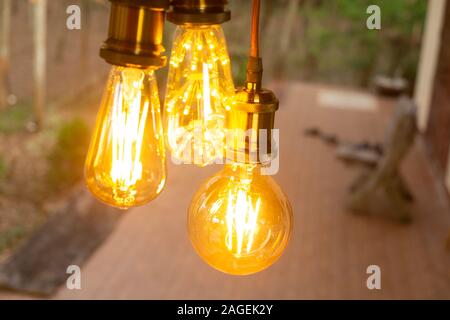Classic retro incandescent led electric lamp warm white on blur background, Vintage light bulb Stock Photo
