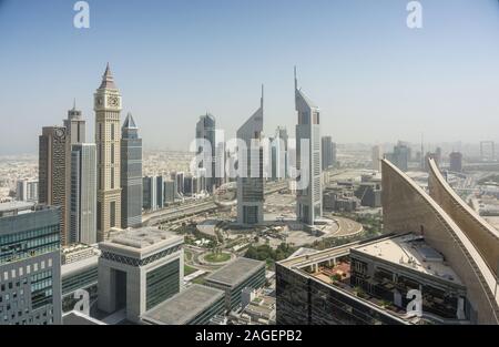 Dubai Clock Tower and Jumeirah Emirates Towers, Dubai, UAE Stock Photo