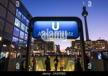 Berlin, Germany. 18th Dec, 2019. The subway station Alexanderplatz in the middle of the evening in the blue hour. On the left the office building 'die mitte', the Alexanderhaus, the Rote Rathaus, the Berolinahaus and the television tower. Credit: Jens Kalaene/dpa-Zentralbild/ZB/dpa/Alamy Live News Stock Photo