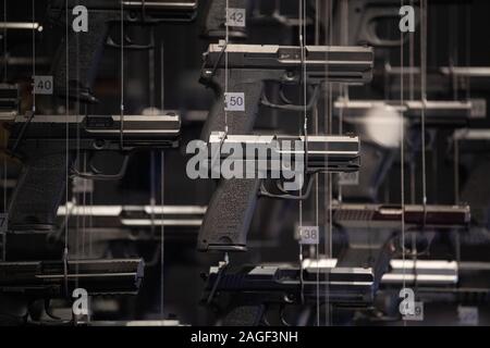 Oberndorf Am Neckar, Germany. 18th Dec, 2019. Pistols hang in a showcase in the museum of the weapons manufacturer Heckler & Koch. Credit: Marijan Murat/dpa/Alamy Live News Stock Photo