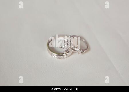 Cluster stack of diamond wedding engagement rings isolated on white . Beautiful jewelry rings . Stock Photo