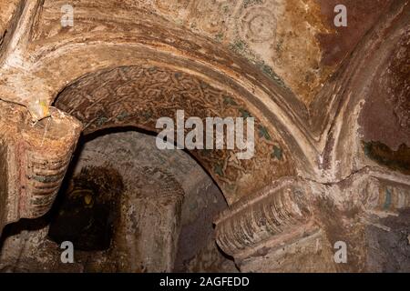 Ethiopia, Amhara Region, Lalibela, Arbatu Ensessa, Biblia Chirkos, ancient rock hewn church, ancient wall painting patterned design above arch Stock Photo