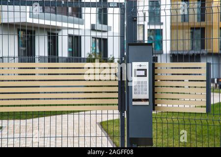 Video intercom on the gate at the entrance to the residential area. Stock Photo