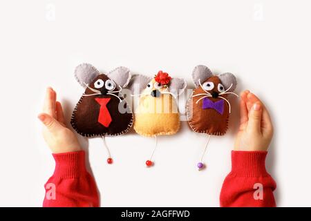 Sewing mouse toys from felt on children's hands. Children's activities concept. symbol of 2020. Happy New Year Stock Photo