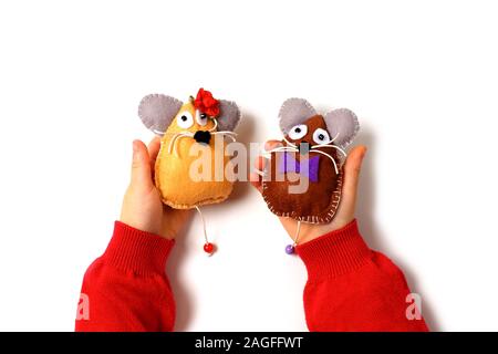 Sewing mouse toys from felt on children's hands. Children's activities concept. symbol of 2020. Happy New Year Stock Photo