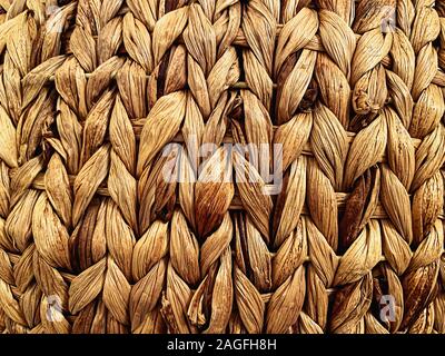 close-up view of a straw basket. Detail on the lines. Handmade product. Texture effect. Retro furniture and decorations Stock Photo