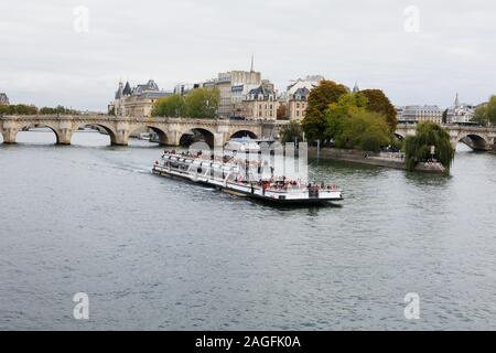 Panoramic view at Seine river with cruise ships and bridge seen from Pont des Arts at Pont Neuf, Paris, France Stock Photo