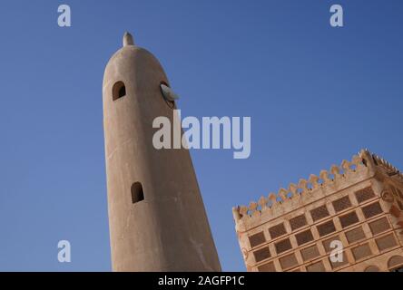 Minaret of the Siyadi Mosque with the Siyadi House behind, on the Bahrain Pearl Trail, Muharraq, Kingdom of Bahrain Stock Photo