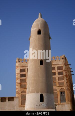 Minaret if the Siyadi Mosque with the Siyadi House behind, on the Bahrain Pearl Trail, Muharraq, Kingdom of Bahrain Stock Photo