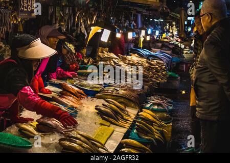 BUSAN, KOREA, SOUTH - Nov 24, 2017: At South Korea's largest seafood market, the Jagalchi ajumma were hard-selling everything to try and not have to s Stock Photo