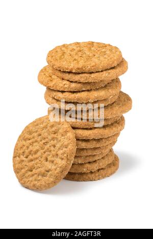 Heap of crunchy healthy oat cookies isolated on white background Stock Photo