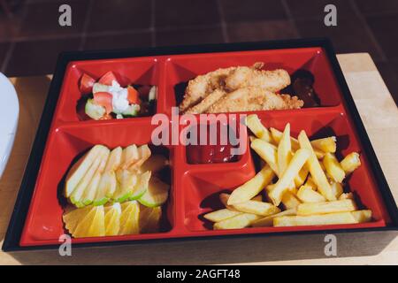 Child food. Funny food. Plate with cutlets and mashed potatoes in the form of a monkey faces. Children's menu Stock Photo