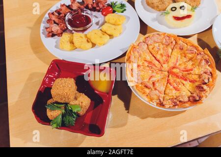 Child food. Funny food. Plate with cutlets and mashed potatoes in the form of a monkey faces. Children's menu Stock Photo