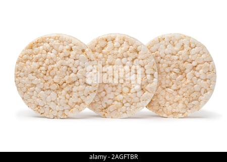 Whole round rice waffles in a row isolated on white background Stock Photo