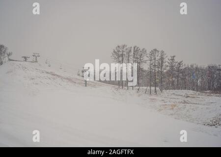 Ski lift chairs on bright winter day Stock Photo