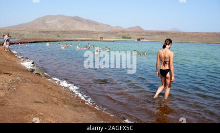 Pedra de Lume, Sal / Cape Verde - 19. November, 2015: many tourists swimming and floating in the salt flat pools of Pedra de Lume on Sal island in Cap Stock Photo