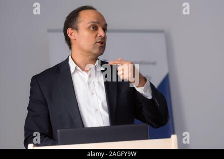 African american business coach gives presentation for businesspeople, multiracial and multiethnic business peoople at conference meeting room. Stock Photo