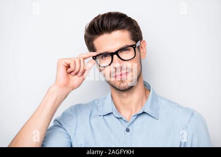 Close up photo of confident serious intelligent clever smart man staring at you intently with new eyewear isolated over color grey background Stock Photo