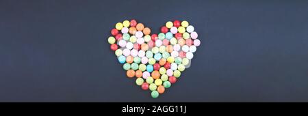 Candy Valentines Hearts on Dark Background. Banner Stock Photo