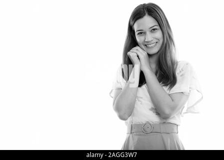 Studio shot of happy young beautiful woman smiling with both hands near face Stock Photo