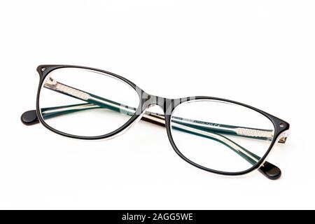 Folded fashion reading glasses for woman on white background Stock Photo