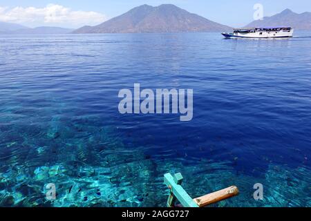 Indonesia Alor Island - reef edge and local ferry Stock Photo