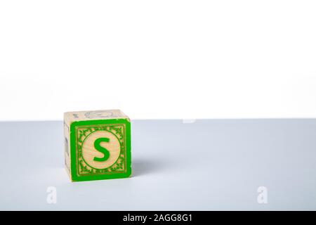 Childrens Wooden Alphabet Block Showing the Letter S Stock Photo