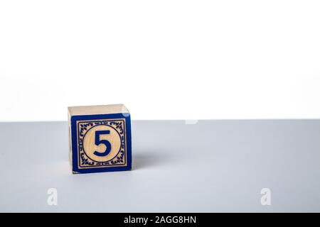 Childrens Wooden Alphabet Block Showing the Number 5 Stock Photo