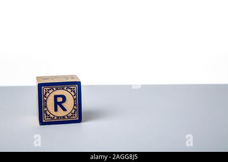 Childrens Wooden Alphabet Block Showing the Letter R Stock Photo