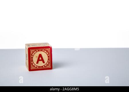 Childrens Wooden Alphabet Block Showing the Letter A Stock Photo