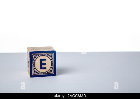 Childrens Wooden Alphabet Block Showing the Letter E Stock Photo