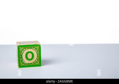 Childrens Wooden Alphabet Block Showing the Letter O Stock Photo