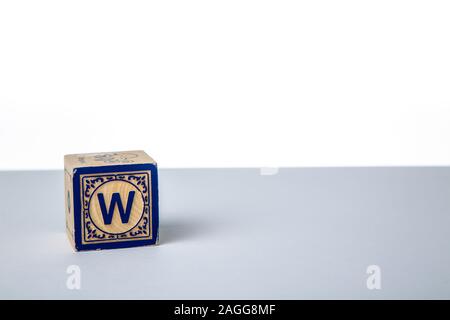 Childrens Wooden Alphabet Block Showing the Letter W Stock Photo