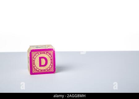 Childrens Wooden Alphabet Block Showing the Letter D Stock Photo