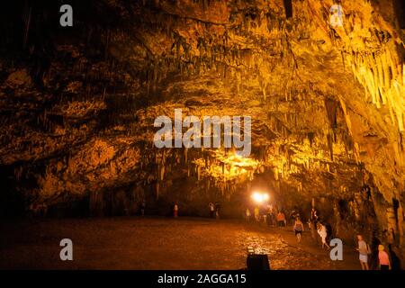 Drogarati cave on Cephalonia Island illuminated in orange, Greece Stock Photo