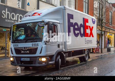 FedEx Express delivery in Fishergate Preston city centre; Haulage delivery trucks, lorry, transportation, truck, cargo carrier, MAN vehicle, European commercial transport industry. Stock Photo