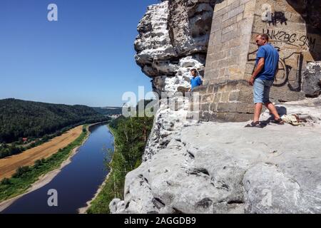Elbe Sandstone Mountains Elbe Valley River landscape Saxon Switzerland National Park People Germany man standing by the support of the Bastei bridge Stock Photo