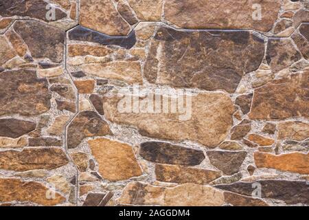 The pebble stone floors and wall, background textures. Warm color tones. Stock Photo
