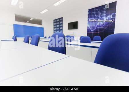 Economy school classroom without students or teachers with chairs and tables in campus. Education concept. Stock Photo