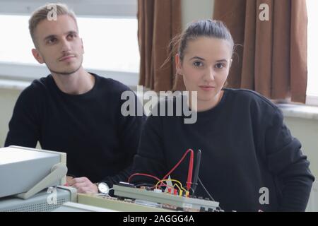 Two young students in technical vocational training, the lesson in technical college. Education and technology concept. Stock Photo