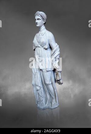 Statue of Artemis, found at the 'House of Diadoumenos' on Delos. Pariam marble, Circa 100 BC. Athens Archaeological Museum, Cat No 1829. Against grey Stock Photo