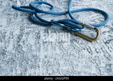 It's lifesavior. Knot with metal carabiner. Silver colored device for the active sports Stock Photo