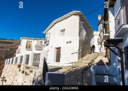 Capileira, La Alpujarra, Alpujarras, Granada region, Andalusia, Spain. Old man with plastic shopping bags in the village. Stock Photo