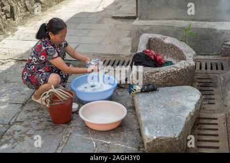 Chinese people, washing clothes in canal, Old Town, Lijiang, Yunnan