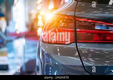 Modern, shiny car red backlight in a car showroom. Stock Photo