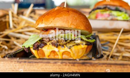 Close-up of home made burgers, fresh tasty cheeseburger. Concept of fast food, restaurant Stock Photo