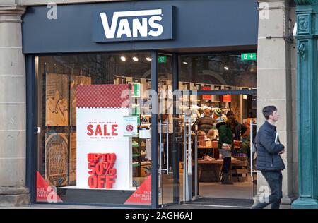 Princes Street, Edinburgh, Scotland, UK. 19th December 2019. Vans, With less than a week to go until Christmas day the majority of the stores in Princes Street are displaying Sale signs with discounts in the shop windows, attempting to draw customers in to splash the cash. Stock Photo